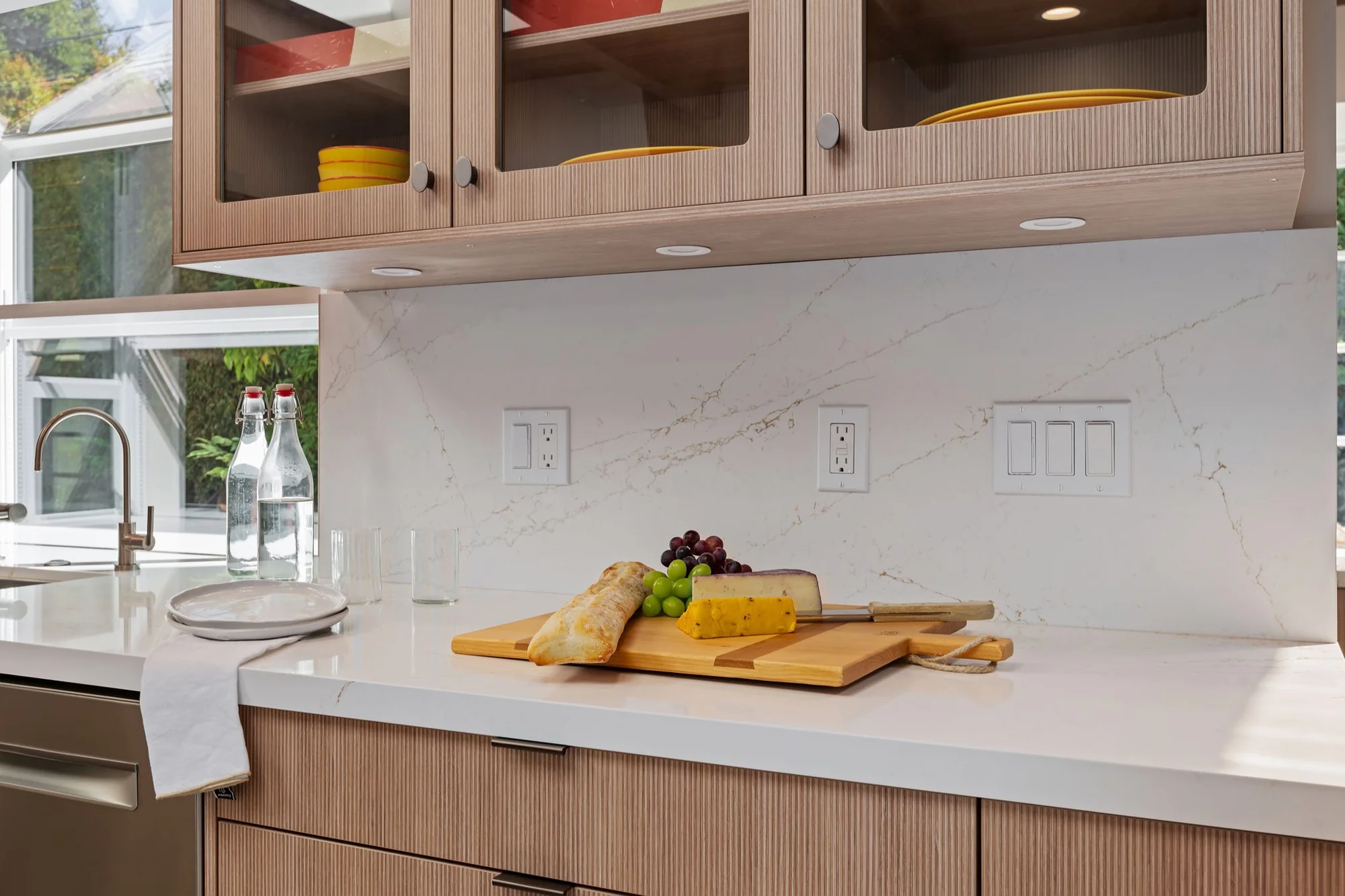 Close detail of the Linear reeded oak texture on the island and range cabinetry